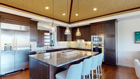 Large gourmet kitchen stocked with a great assortment of spices and oils