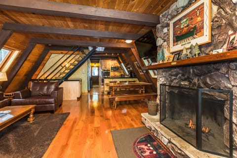 Living room on the mid level looking toward the kitchen and stairs