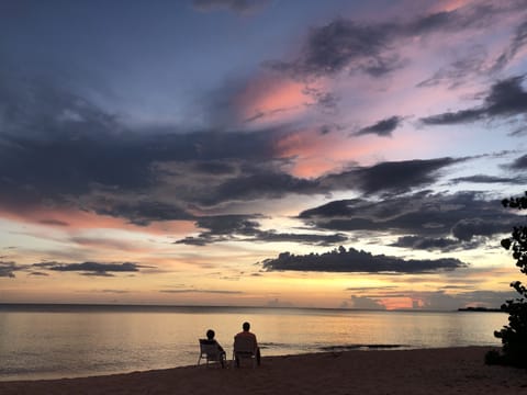 On the beach, sun loungers, beach towels