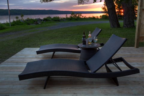 Loungers on the deck during a summer sunset