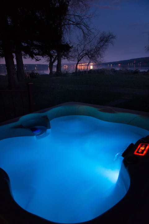 Twilight view from the hot tub of the peaceful lake & Ithaca in the distance