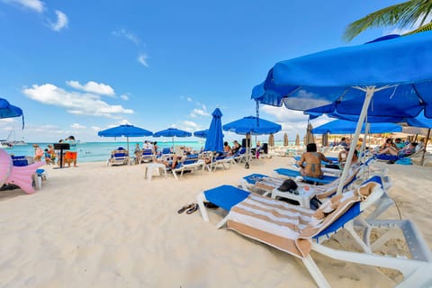 On the beach, sun loungers, beach towels