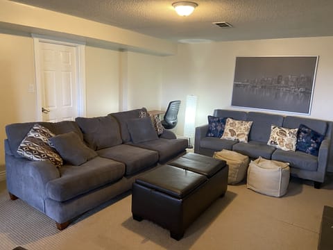 Two large sofas, one is queen size pull out sofa bed.