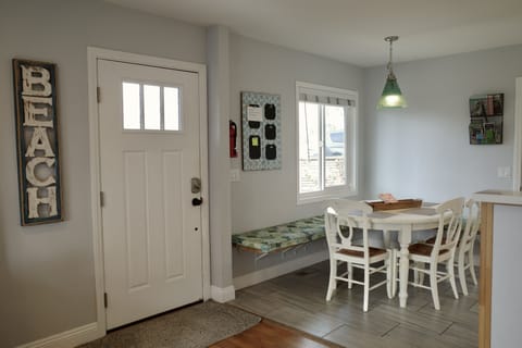 The front door opens to the fully fenced patio. 