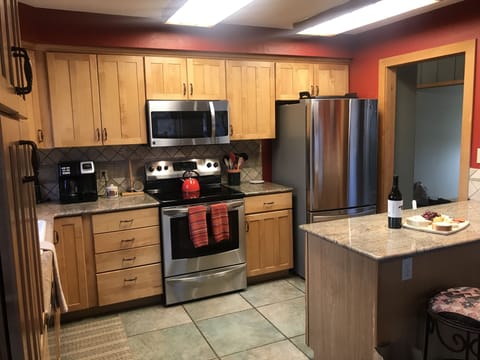 Kitchen with updated Stainless Steel appliances, full sized oven & microwave