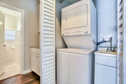 Washer/dryer combo and laundry sink inside the unit.