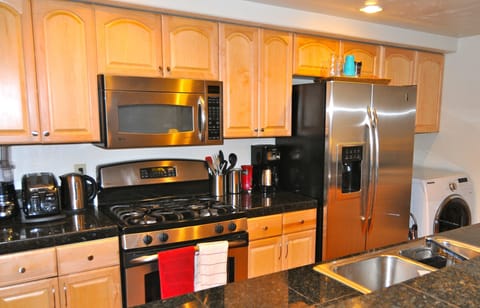 Fully equipped and remodeled Kitchen w/ Granite & stainless steel appliances.