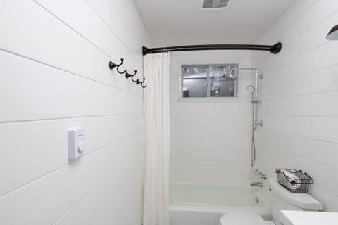 Combined shower/tub, hair dryer, towels, soap