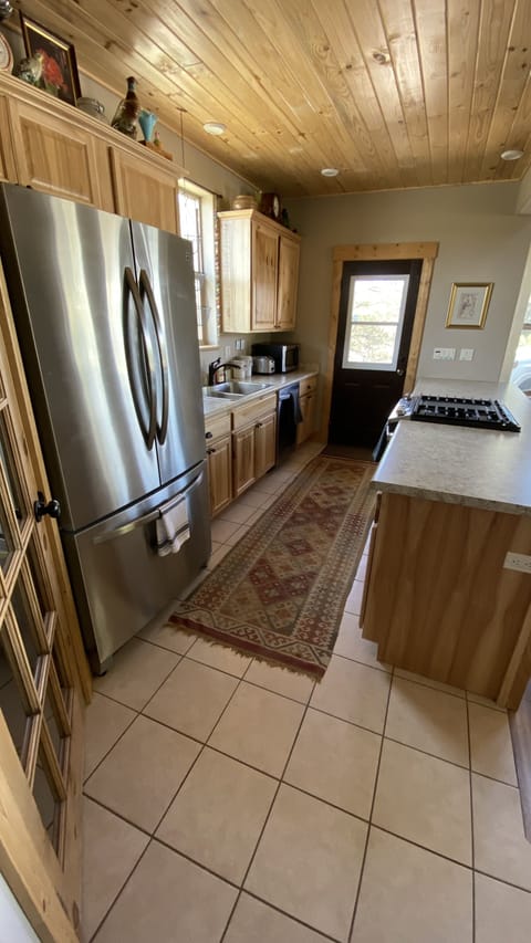 Fully stocked galley kitchen with all your cooking needs