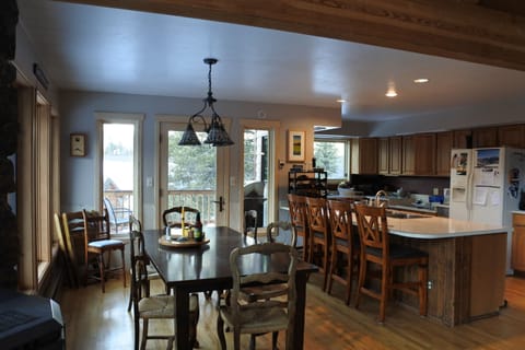 Large kitchen with dining area & gas grill on the porch