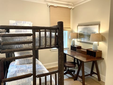 Bunk room with desk