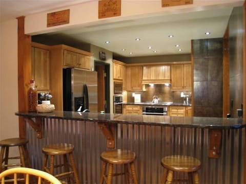 Our all new kitchen with stainless steel appliances and bar seating for 4
