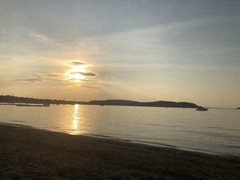 On the beach, sun loungers, beach towels