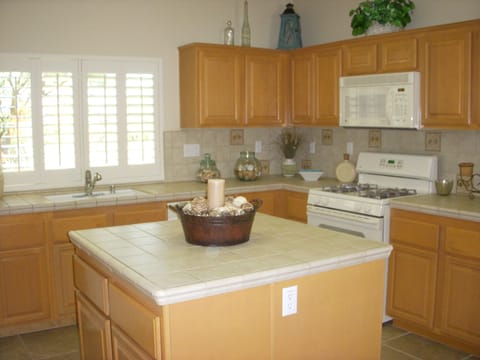 Kitchen with Stove and Microwave. Cooking Island.