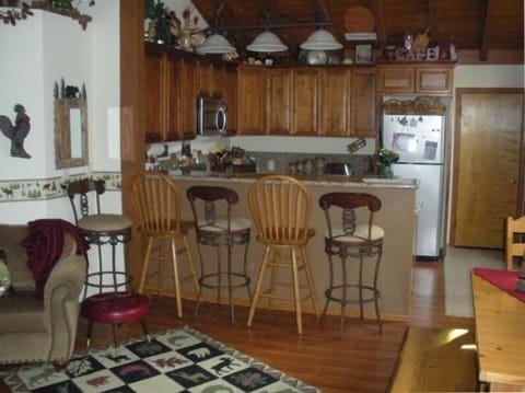 Dining room seats 8
at table, kitchen bar seats 5!