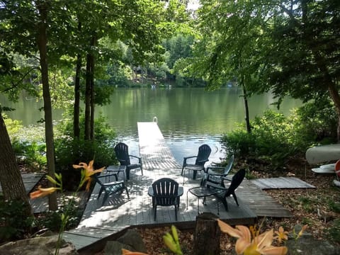 View of waterfront sitting area and seasonal floating dock
