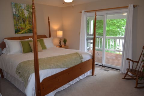 King bed with gorgeous lake views on main level.