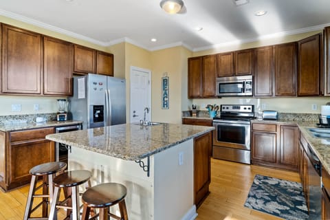 Fully equipped kitchen with dual sinks.