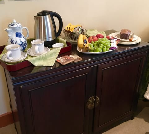 Tea and treats table. Fresh fruit, energy bars and homemade banana bread.