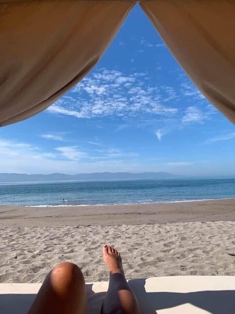 On the beach, sun loungers, beach towels