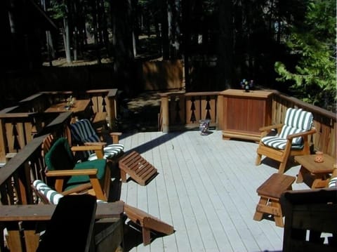 Backyard deck in fenced yard