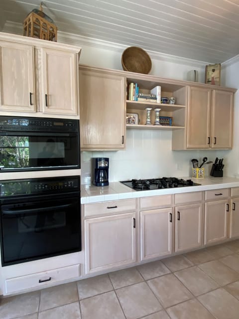 Kitchen, drip coffee making, kuerig and french press.