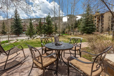 Patio table with four chairs and Gas Grill
overlooking Vail Mountain