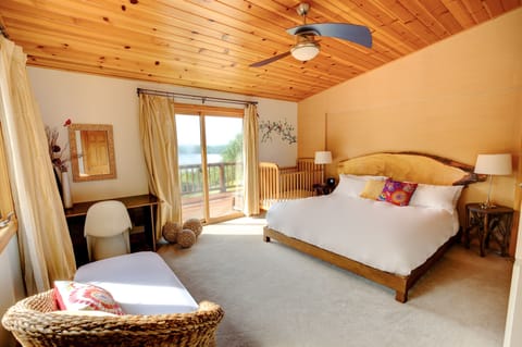 Maple - Master Bedroom with King bed, ensuite bathroom, deck and lake views.