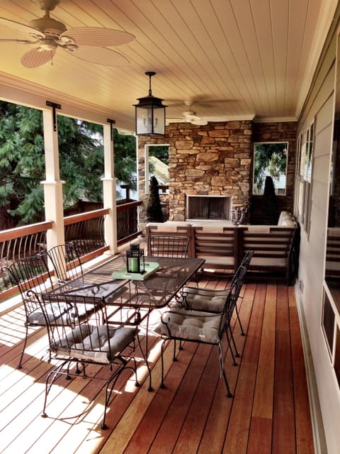 Covered Back Patio w/Wood-Burning Fireplace. and Lounge Area and Dining Table