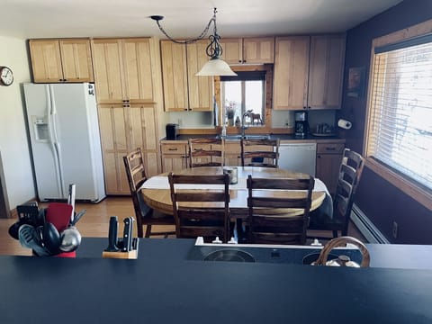 Kitchen - adding 2 table leaves seats up to 8-10, with seating for 3 at counter