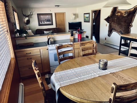 Kitchen - adding 2 table leaves seats up to 8-10, with seating for 3 at counter