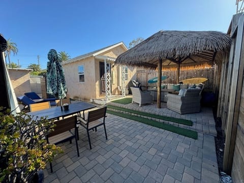 Private patio; outdoor dining and seating under the palapa also with a fire pit.