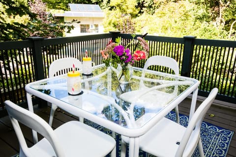 Private Deck with gas grill and dining for four with view of pool