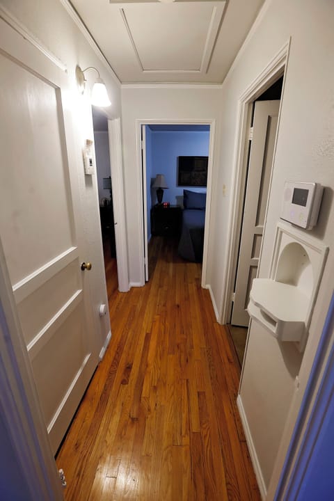 Bright, clean hallway connecting the living spaces with a welcoming feel.