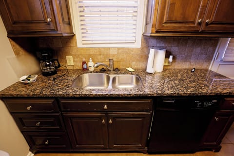 Kitchen with a double sink and dishwasher for easy cleanup after meals.