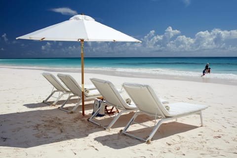 On the beach, sun loungers, beach towels