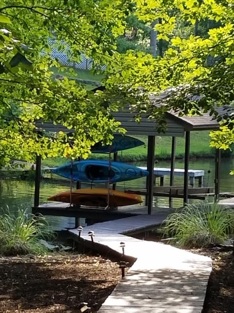 Kayaks for guest use and a shot of our boathouse with public dock next to it. 