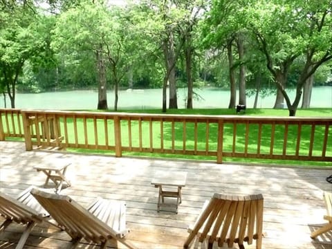 Relax on the large deck overlooking the beautiful yard and amazing views