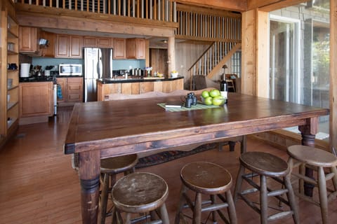 Dining room table with kitchen in background