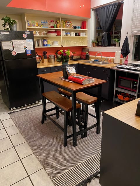 Tiled kitchen area and open format.