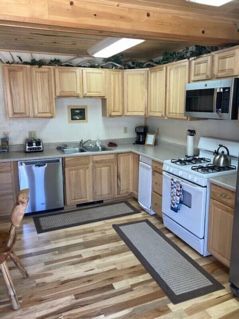 Kitchen updated in 2022: new floor, table and newer appliances.