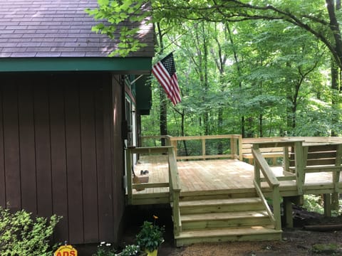 expansive deck serves as the entry point for the cabin