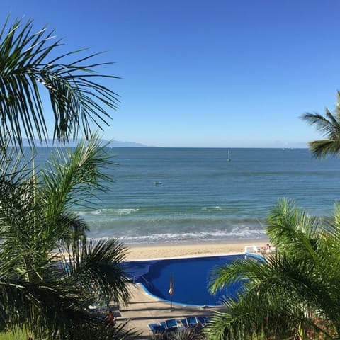 On the beach, sun loungers, beach towels