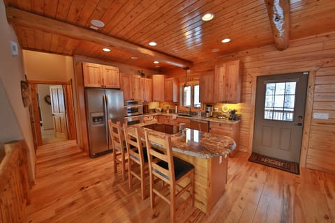 Kitchen with bar seating.