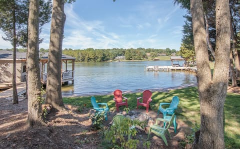 Beautiful lake front with beach, firepit and 1600 sf boathouse.