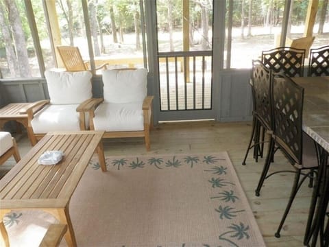 BACK DECK WITH ROCKING CHAIRS AND SCREENED PORCH