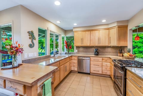 Cook with ease in the spacious kitchen, featuring modern appliances and plenty of counter space.