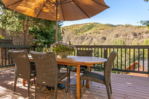 Huge wrap around deck with Dining Area, Hot Tub and BBQ Center