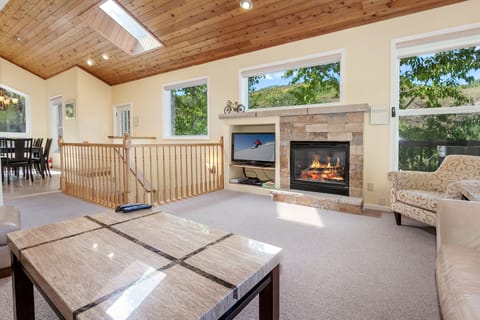 Main Living Room with gas fireplace and big screen TV for after skiing!
