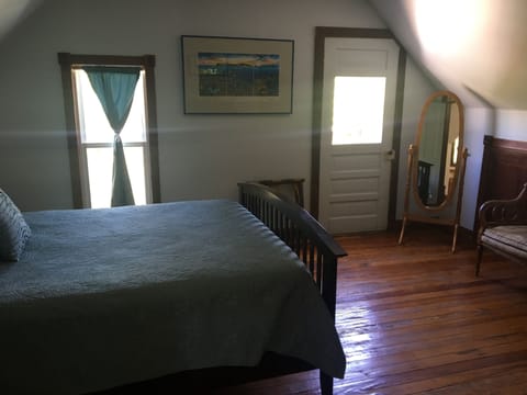 Quiet and spacious queen bedroom with attached balcony located on upper level
